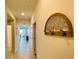 Long hallway featuring artwork and access to other rooms in the home at 3121 Paradox Cir # 307, Kissimmee, FL 34746