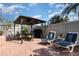 Outdoor patio featuring a dining area, grill, lounge chairs, and privacy fence at 3244 Amaca Cir, Orlando, FL 32837