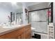 Updated bathroom with modern vanity, frameless glass shower, and elegant fixtures at 3244 Amaca Cir, Orlando, FL 32837