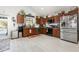 Spacious kitchen featuring wood cabinetry, stainless steel appliances, and ample counter space at 3244 Amaca Cir, Orlando, FL 32837