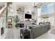 A spacious open-concept living area features a fireplace and custom shelving at 3244 Amaca Cir, Orlando, FL 32837