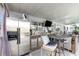 Covered outdoor bar area, equipped with a stainless steel refrigerator and seating at 3244 Amaca Cir, Orlando, FL 32837