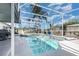 Covered pool area featuring a refreshing pool, clear enclosure, and landscaped surroundings at 3244 Amaca Cir, Orlando, FL 32837