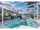 Backyard pool with screened enclosure, patio, and outdoor seating area perfect for relaxing and enjoying the sun at 3244 Amaca Cir, Orlando, FL 32837