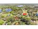 An aerial view of the community's gated entrance, nearby Flagler Trail, and area lakes at 330 Osprey Lakes Cir, Chuluota, FL 32766