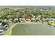 Aerial view of home showing lake access, large backyard, and proximity to other homes at 330 Osprey Lakes Cir, Chuluota, FL 32766