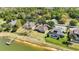 Aerial view of home with a large backyard, waterfront, and lovely neighborhood at 330 Osprey Lakes Cir, Chuluota, FL 32766