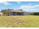Spacious backyard with lush grass, offering ample room for recreation and outdoor enjoyment at 330 Osprey Lakes Cir, Chuluota, FL 32766