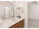 Bathroom with vanity with a sink, lighting, and a mirror over the sink and a view to the bedroom at 330 Osprey Lakes Cir, Chuluota, FL 32766