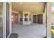 An inviting covered patio space with a neutral color scheme, leading out to the backyard at 330 Osprey Lakes Cir, Chuluota, FL 32766