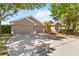 Charming home with a two-car garage and manicured landscaping at 330 Osprey Lakes Cir, Chuluota, FL 32766