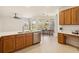 Spacious kitchen with stainless steel appliances and an adjacent breakfast nook with banquette seating at 330 Osprey Lakes Cir, Chuluota, FL 32766