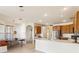 Open kitchen connected to a bright breakfast nook, showcasing modern appliances and cabinetry at 330 Osprey Lakes Cir, Chuluota, FL 32766