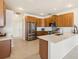Spacious kitchen with stainless steel appliances and granite countertops at 330 Osprey Lakes Cir, Chuluota, FL 32766