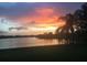 Beautiful lake view at sunset with palm trees at 330 Osprey Lakes Cir, Chuluota, FL 32766