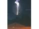 Night view of rocket launch visible behind trees and over a fence and building at 330 Osprey Lakes Cir, Chuluota, FL 32766