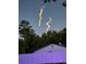 Night view of a rocket launch behind a white fence and house at 330 Osprey Lakes Cir, Chuluota, FL 32766