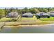 Rear exterior of home with fenced backyard and waterfront access at 330 Osprey Lakes Cir, Chuluota, FL 32766