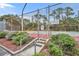 Well-maintained community tennis courts featuring new fencing and established greenery at 336 Scottsdale Sq # 336, Winter Park, FL 32792