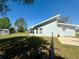 Large backyard with spacious lawn and a screened-in porch perfect for outdoor relaxation at 38 Juniper Pass Dr, Ocala, FL 34480