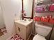 The bathroom has a single vanity and flower patterned accessories at 38 Juniper Pass Dr, Ocala, FL 34480