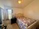Cozy bedroom with natural light and ceiling fan at 38 Juniper Pass Dr, Ocala, FL 34480