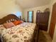 Cozy bedroom featuring a comfortable bed with floral bedding and a large dresser at 38 Juniper Pass Dr, Ocala, FL 34480