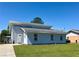 Charming two-story home with a well-manicured lawn and a classic white front door at 38 Juniper Pass Dr, Ocala, FL 34480