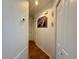 The hallway has wood-look floors and doors for easy access to other rooms at 38 Juniper Pass Dr, Ocala, FL 34480