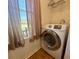 Convenient laundry area with modern appliances and a window with a view at 38 Juniper Pass Dr, Ocala, FL 34480