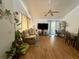 Comfortable living room featuring a ceiling fan, a comfortable-looking beige sofa, and wood flooring at 38 Juniper Pass Dr, Ocala, FL 34480