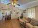 Cozy living room with bright, airy ambiance; and a glimpse of the kitchen at 38 Juniper Pass Dr, Ocala, FL 34480