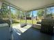 Enclosed patio with grill and view of the backyard at 38 Juniper Pass Dr, Ocala, FL 34480