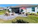 Inviting backyard features a paver patio with firepit and grill, perfect for outdoor entertaining at 4562 Tribute Trl, Kissimmee, FL 34746