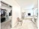 Bright bathroom featuring a separate shower and soaking tub, complemented by a spacious walk-in closet at 4562 Tribute Trl, Kissimmee, FL 34746