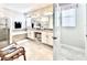 Bright, spacious bathroom boasting a separate shower and soaking tub, enhanced by stylish fixtures and finishes at 4562 Tribute Trl, Kissimmee, FL 34746