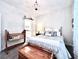 Cozy bedroom with neutral tones, a comfortable bed, and charming decor at 4562 Tribute Trl, Kissimmee, FL 34746