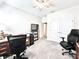 Well-lit home office showcasing bright interior, plush carpet, and a practical layout for productive work from home at 4562 Tribute Trl, Kissimmee, FL 34746