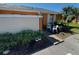 Exterior of a one-story home with a walkway and potted plants at 46 Silver Park Cir, Kissimmee, FL 34743