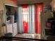 Bright kitchen area featuring a laundry setup and window at 46 Silver Park Cir, Kissimmee, FL 34743