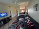 Cozy living room with tile floors, ceiling fan, and comfortable seating area at 46 Silver Park Cir, Kissimmee, FL 34743