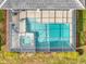 Aerial view of a screened in pool with a jacuzzi, the perfect spot for outdoor relaxation at 4704 Sleepy Hollow Dr, Kissimmee, FL 34746