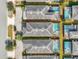 An aerial view showcases tidy rows of homes, each with a private pool, and orderly landscaping throughout the neighborhood at 4704 Sleepy Hollow Dr, Kissimmee, FL 34746