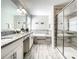 Beautiful bathroom featuring double sinks, a soaking tub, and a glass-enclosed shower for luxurious comfort at 4704 Sleepy Hollow Dr, Kissimmee, FL 34746