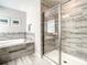 Modern bathroom showcasing a tiled shower with a glass door, a soaking tub, and stylish fixtures at 4704 Sleepy Hollow Dr, Kissimmee, FL 34746