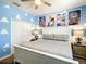 Bright bedroom featuring Toy Story themed decor, a comfortable bed, and ample closet space at 4704 Sleepy Hollow Dr, Kissimmee, FL 34746