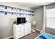 Well-lit bedroom featuring 'Frozen' themed decor, white dresser with TV, and neutral carpeting at 4704 Sleepy Hollow Dr, Kissimmee, FL 34746