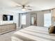 Well lit bedroom featuring soft neutral tones, comfortable bedding, and a full sized mirror at 4704 Sleepy Hollow Dr, Kissimmee, FL 34746