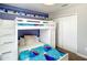 A bedroom featuring 'Frozen' themed decor, a bunk bed, and a closet with double doors at 4704 Sleepy Hollow Dr, Kissimmee, FL 34746