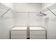 Organized closet with wire shelving, hanging rod, and drawer units providing efficient storage solutions at 4704 Sleepy Hollow Dr, Kissimmee, FL 34746
